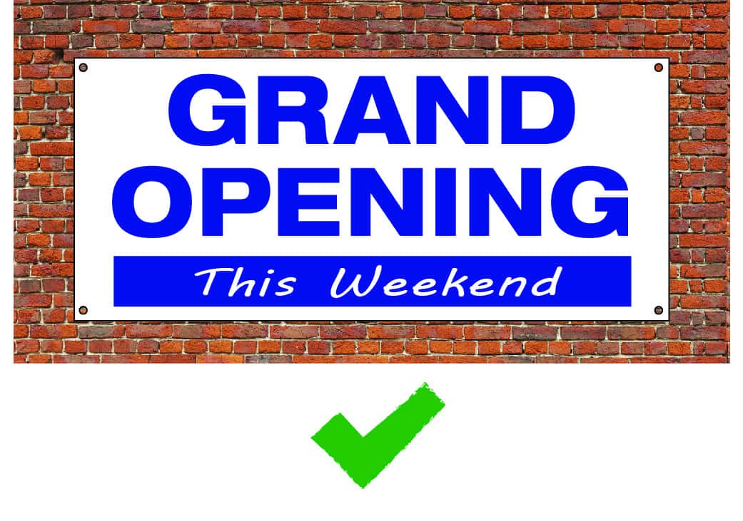 Readable vinyl banner with bold blue text saying "Grand Opening This Weekend" on a white background.